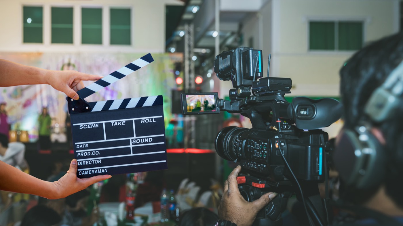 A slate held in front of a camera operator